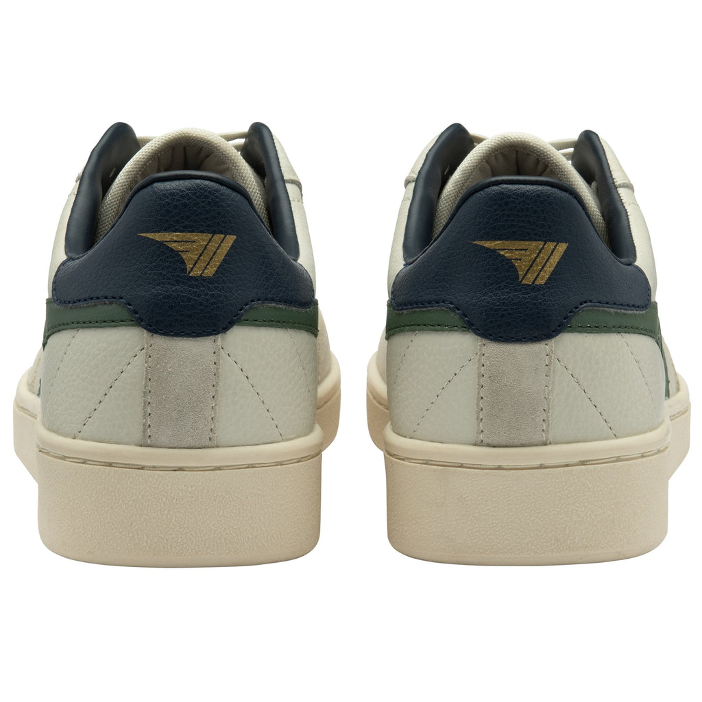 The back of a pair of white and green Gola sneakers.