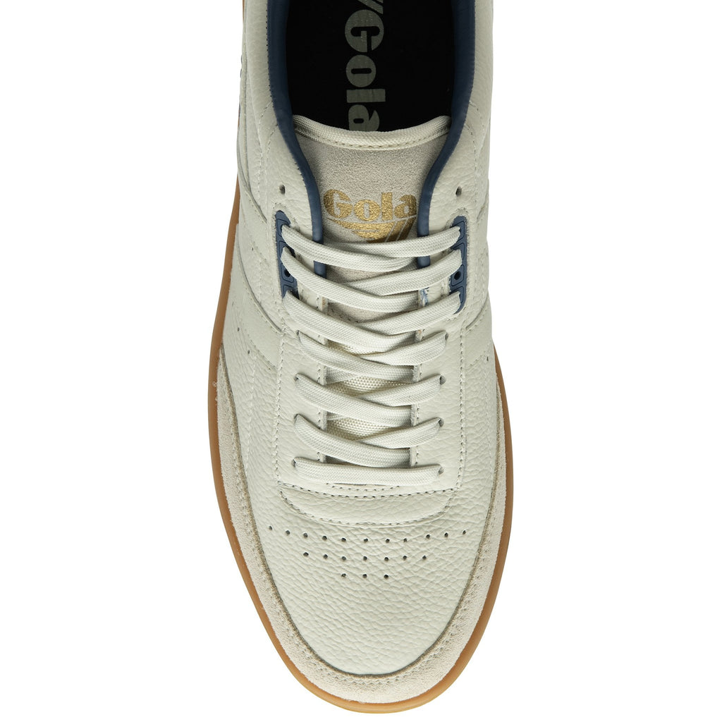 The top-down view of a single white Gola sneaker with blue accents and a gum sole.