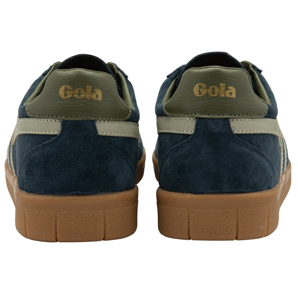 The back of two navy suede Gola sneakers with gum soles and tan accents.