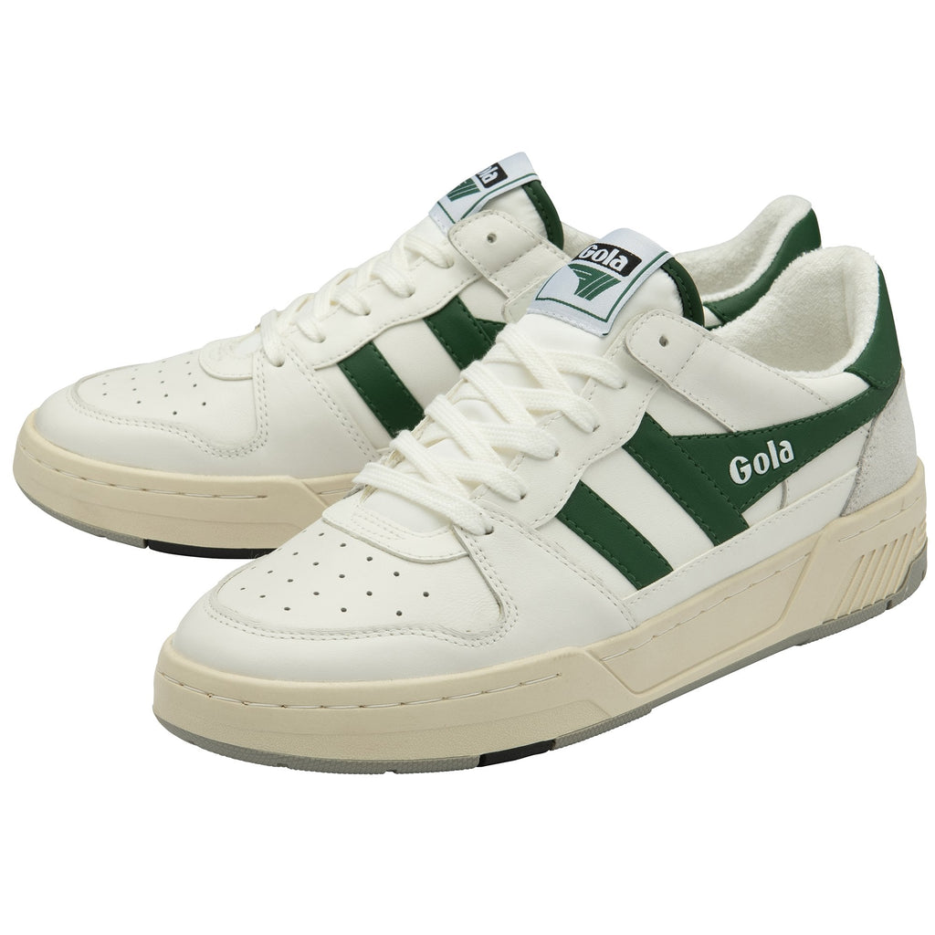 Pair of white Gola sneakers with green stripes and tan soles from a three-quarter view.