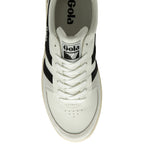 A top-down view of a white Gola sneaker with black stripes.