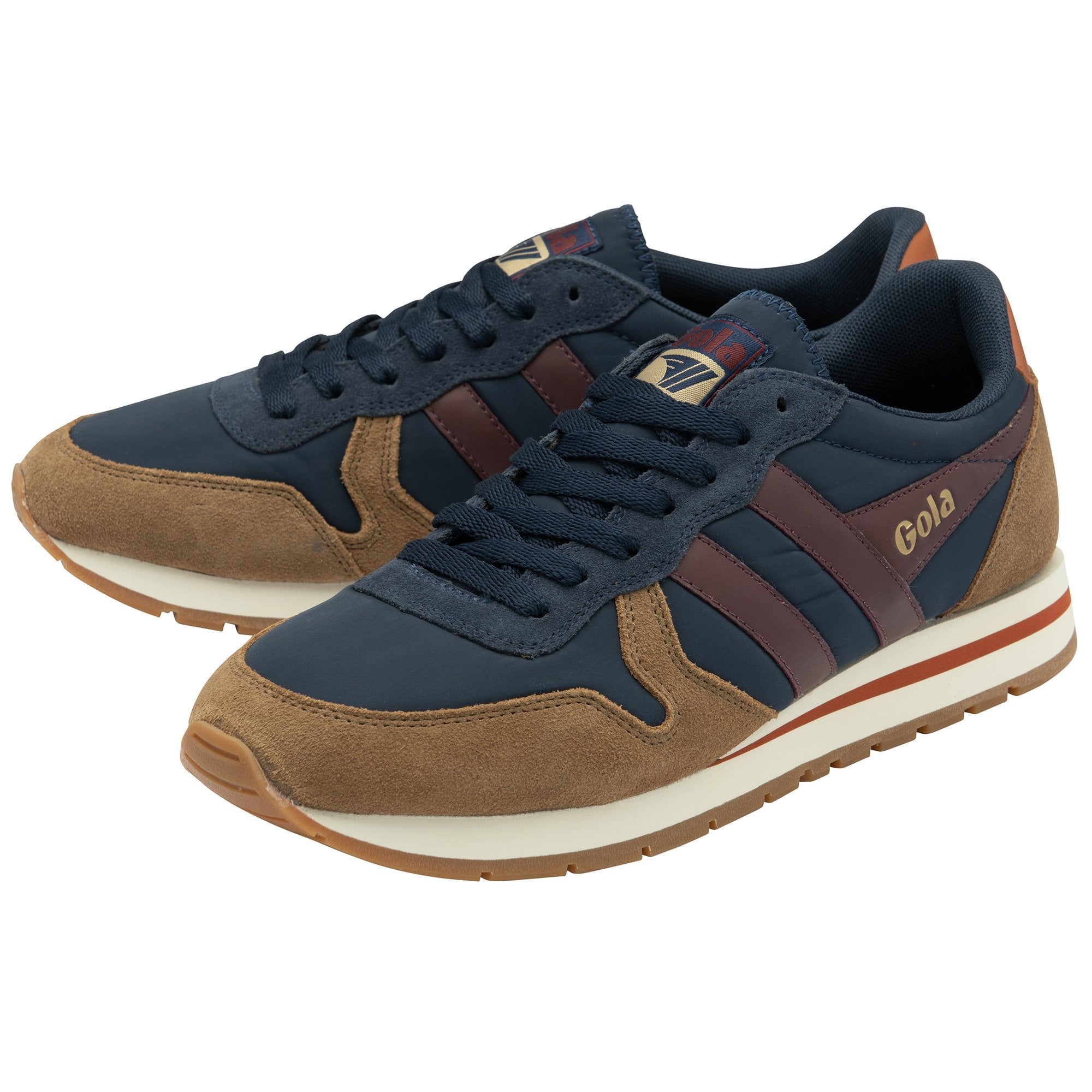 A pair of Gola sneakers in navy and brown from the side.