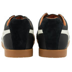 The back view of two black Gola men's shoes with white stripes and tan soles.