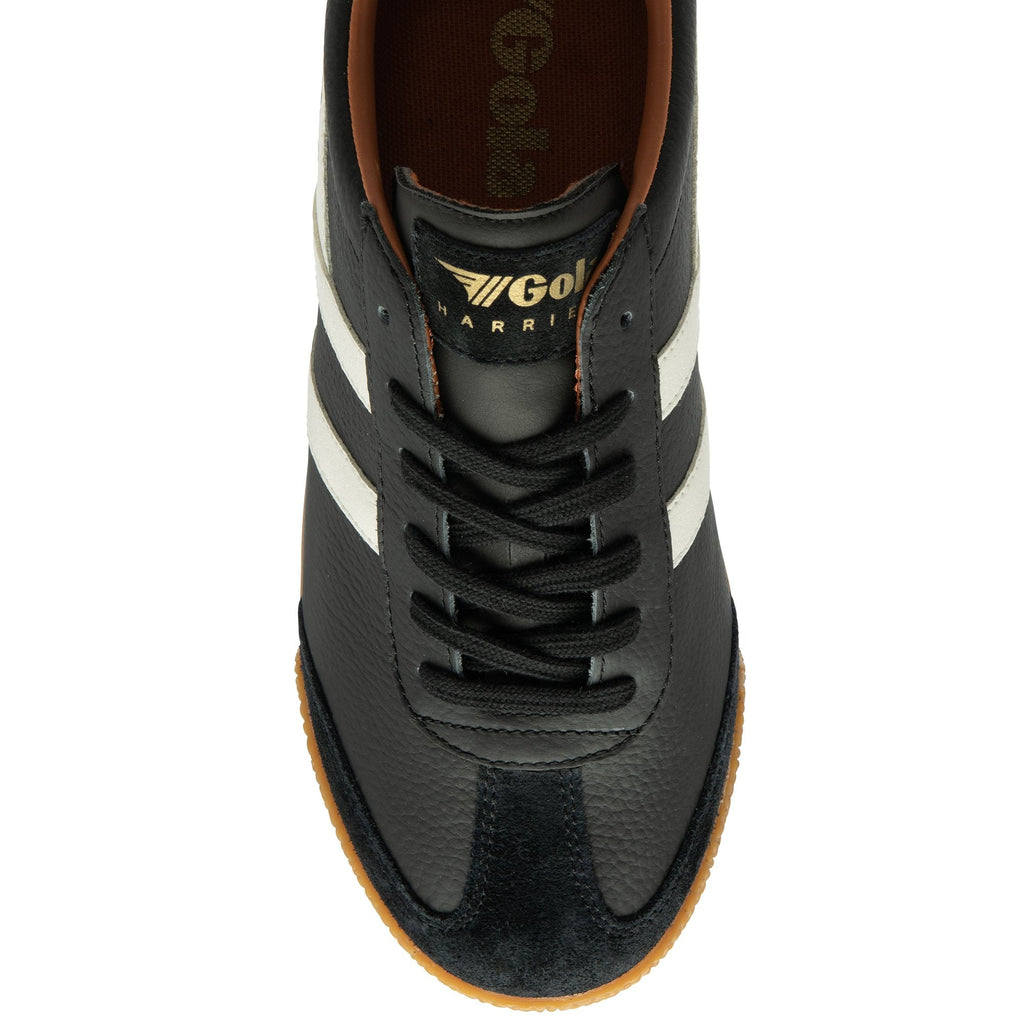 The top view of a black Gola men's shoe with white stripes and a tan sole.