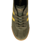 Close up of a Gola Harrier trainer in khaki green suede with yellow side stripes and a gum sole