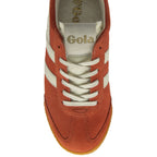 A single Gola women's trainer in sun orange, cream, and magenta, top view.
