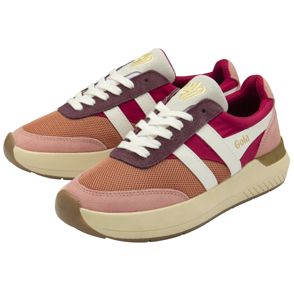A pair of Gola women's trainers in shades of pink and orange, with white stripes.