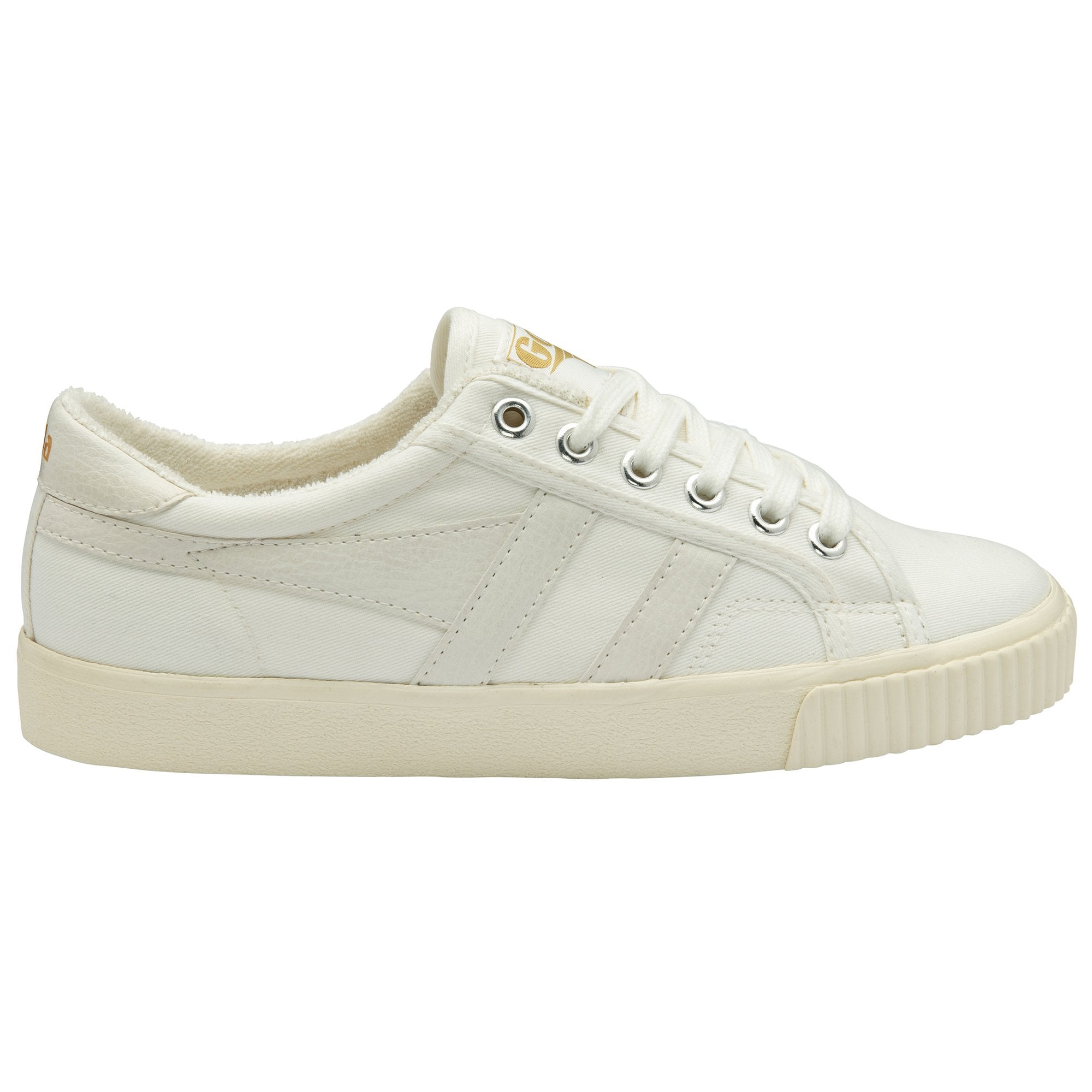 A white canvas sneaker with cream sole and laces, seen from the side.