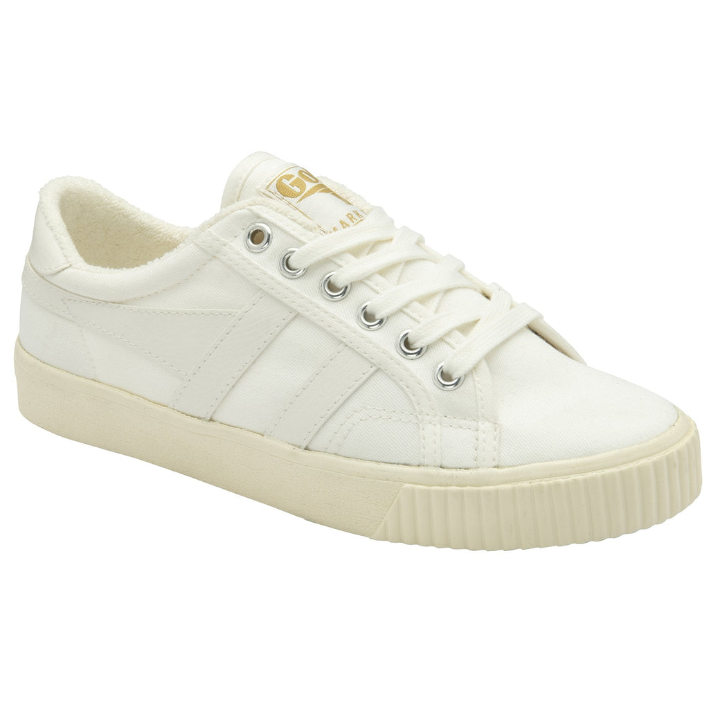 A white canvas sneaker with cream sole and laces, viewed from a slight angle.