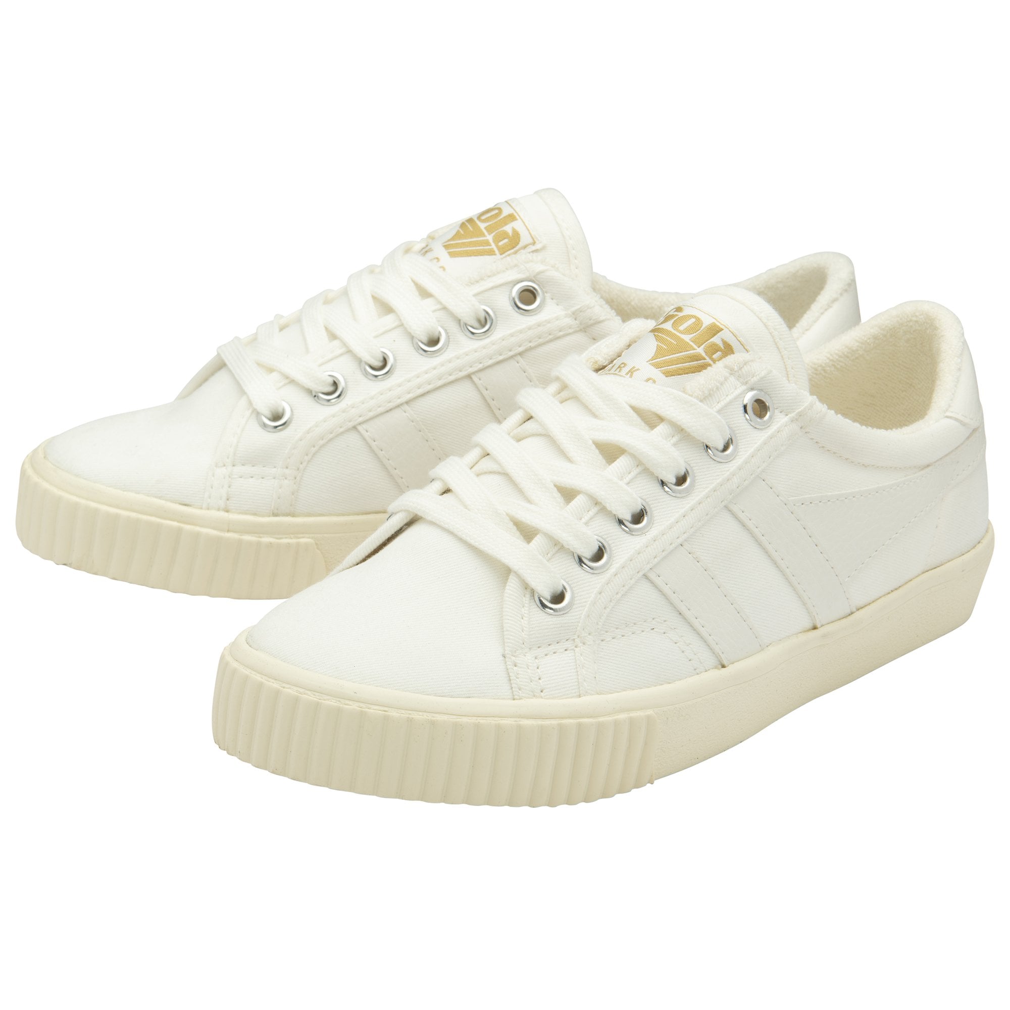 A pair of white canvas sneakers with cream soles and laces.