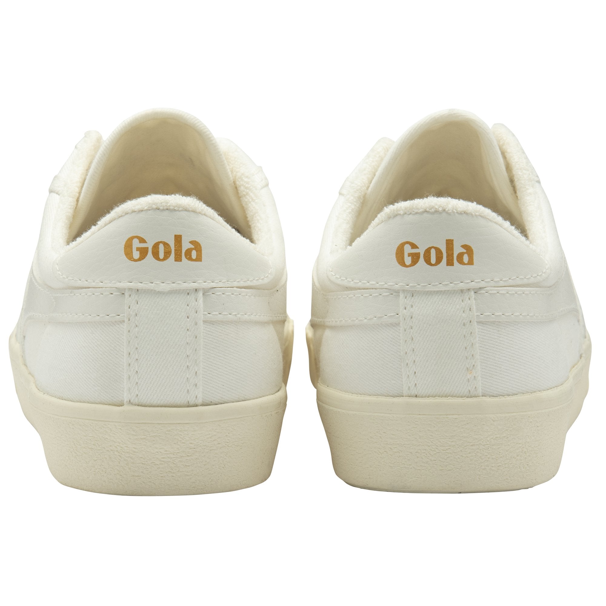 The heels of two white canvas sneakers, showing the Gola logo in gold.