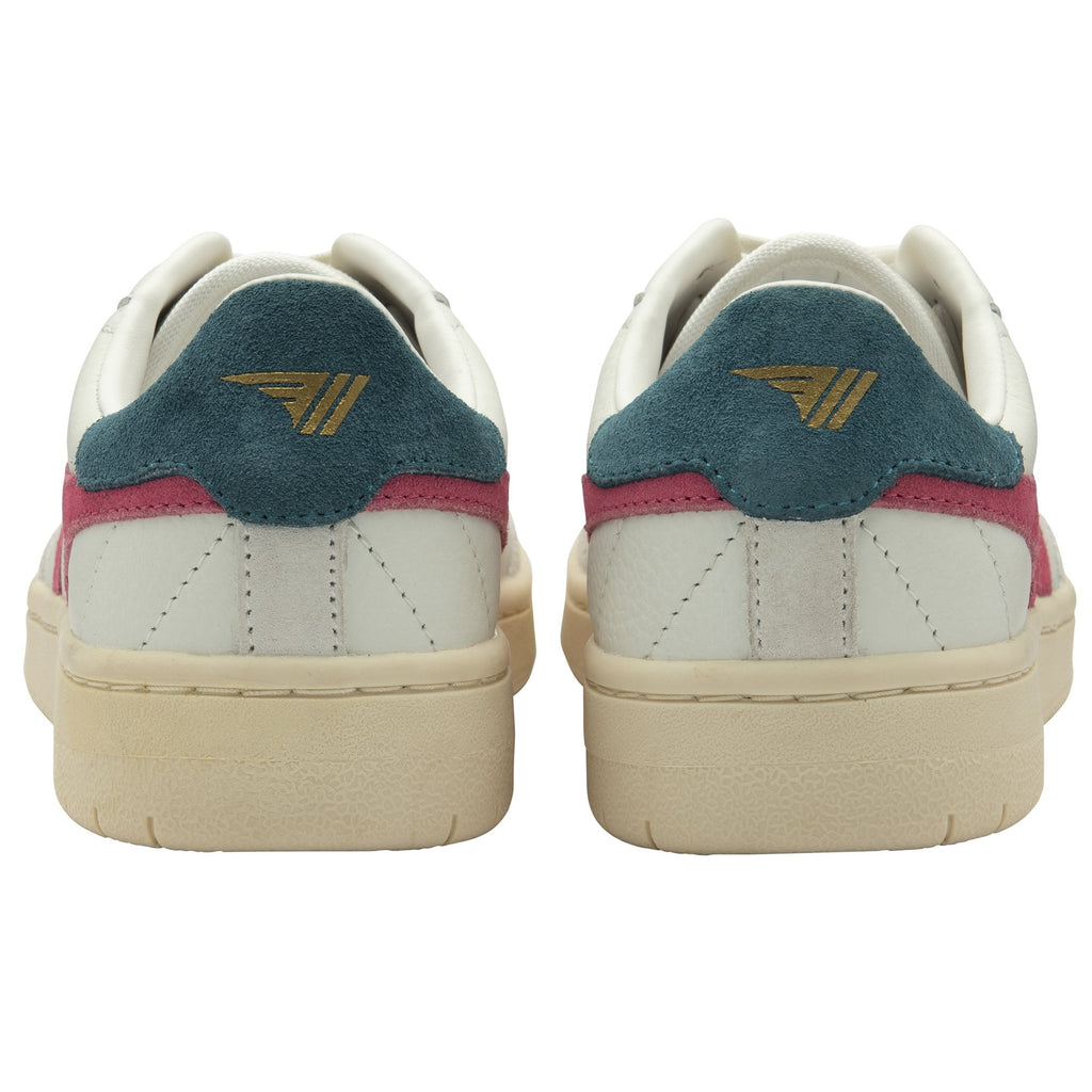 The back view of two white sneakers, showing teal heel accents with gold logos.