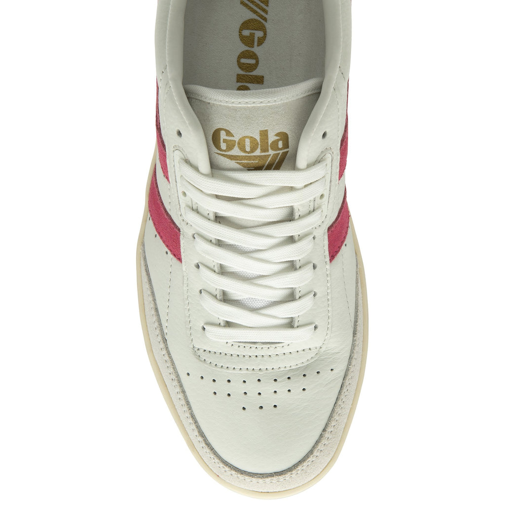 A top-down view of a white sneaker with red stripes, white laces, and a gold logo.