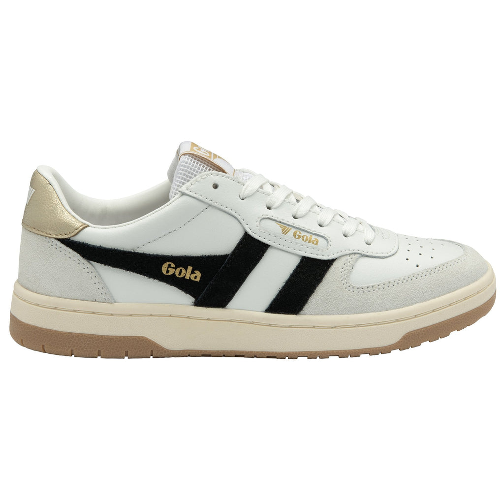 Side view of a white Gola sneaker with black stripes and gold accents.