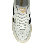 Top down view of a white Gola sneaker with black stripes and gold logo.