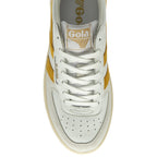 The top-down view of a white and gold Gola sneaker, highlighting the laces and tongue.