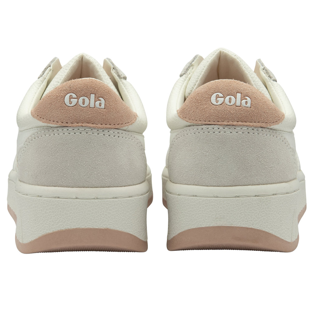 The back view of two white Gola sneakers with blush pink heels and soles.