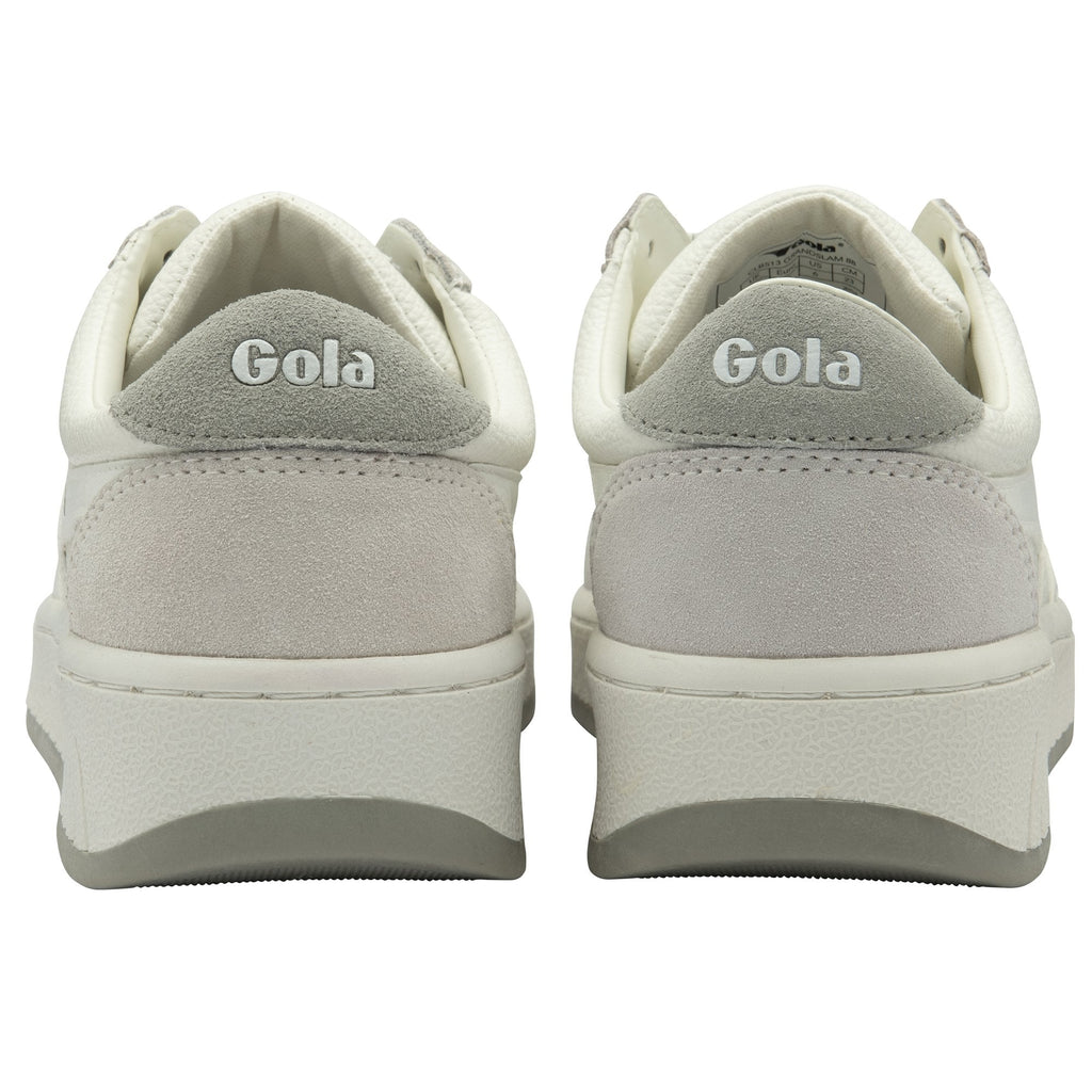 The back view of a pair of white and grey Gola sneakers.