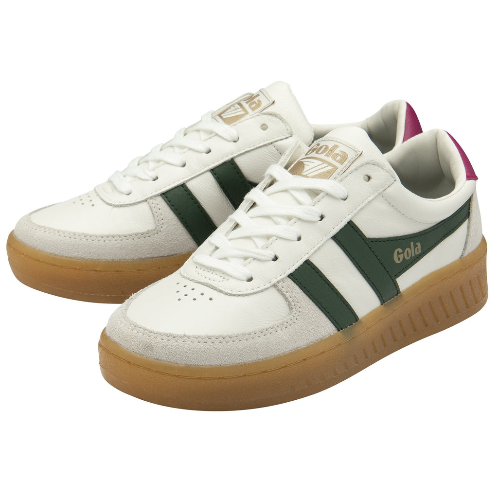 Pair of white Gola sneakers with green stripes, gum soles, and magenta heel tabs.