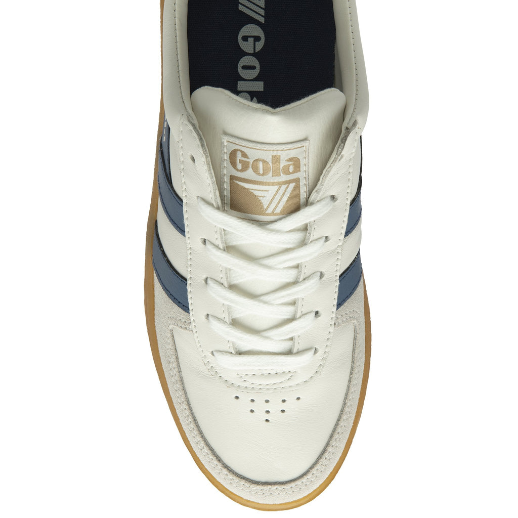An overhead view of a white Gola sneaker with blue stripes and brown sole.