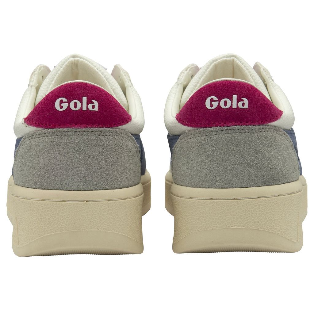 The backs of two Gola sneakers with pink accents and the brand name.