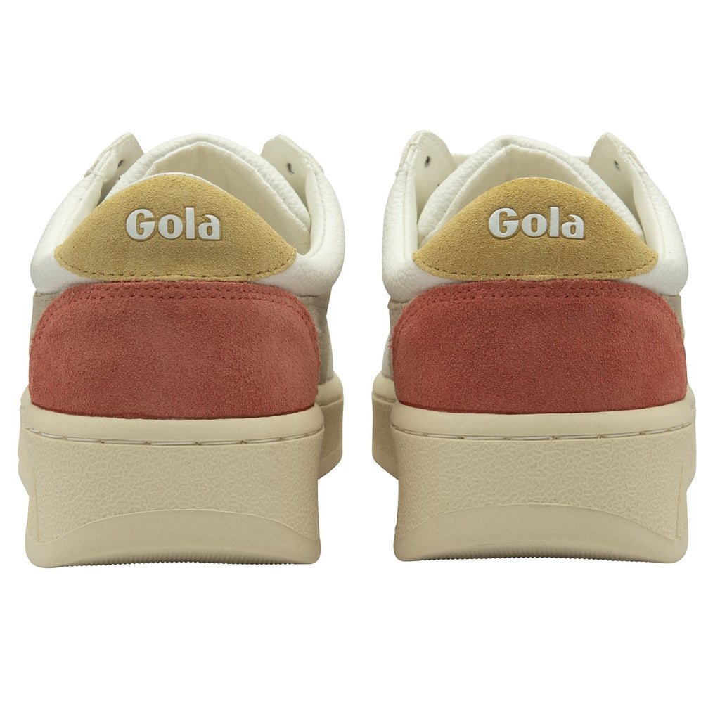 The back view of two white Gola sneakers with red heels and yellow Gola logos.