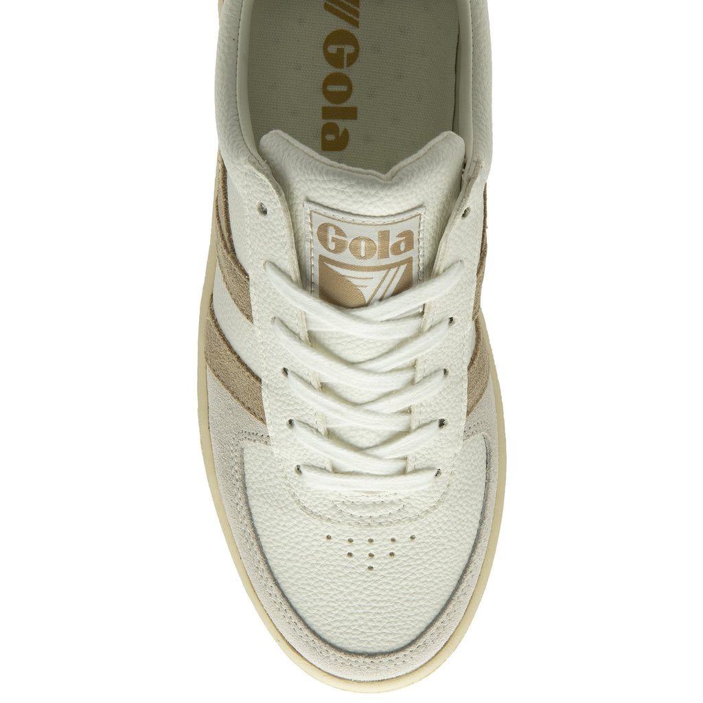 An overhead view of a white Gola sneaker with beige stripes and white laces.