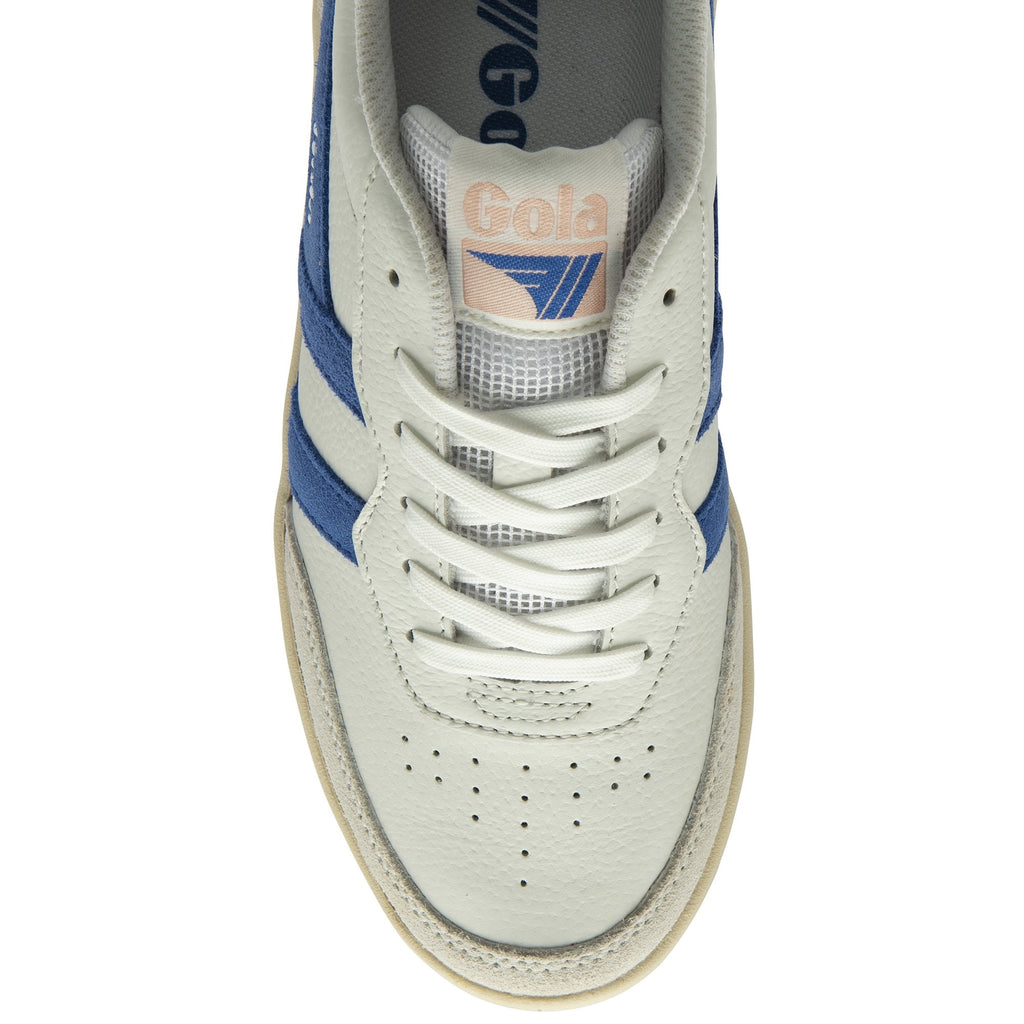 Top-down view of a white Gola sneaker with blue stripes and white laces.