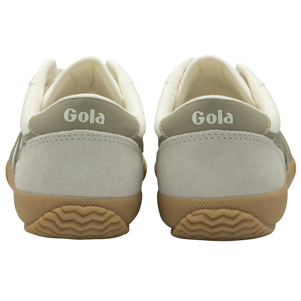 The back view of a pair of Gola white and gray sneakers with brown soles.