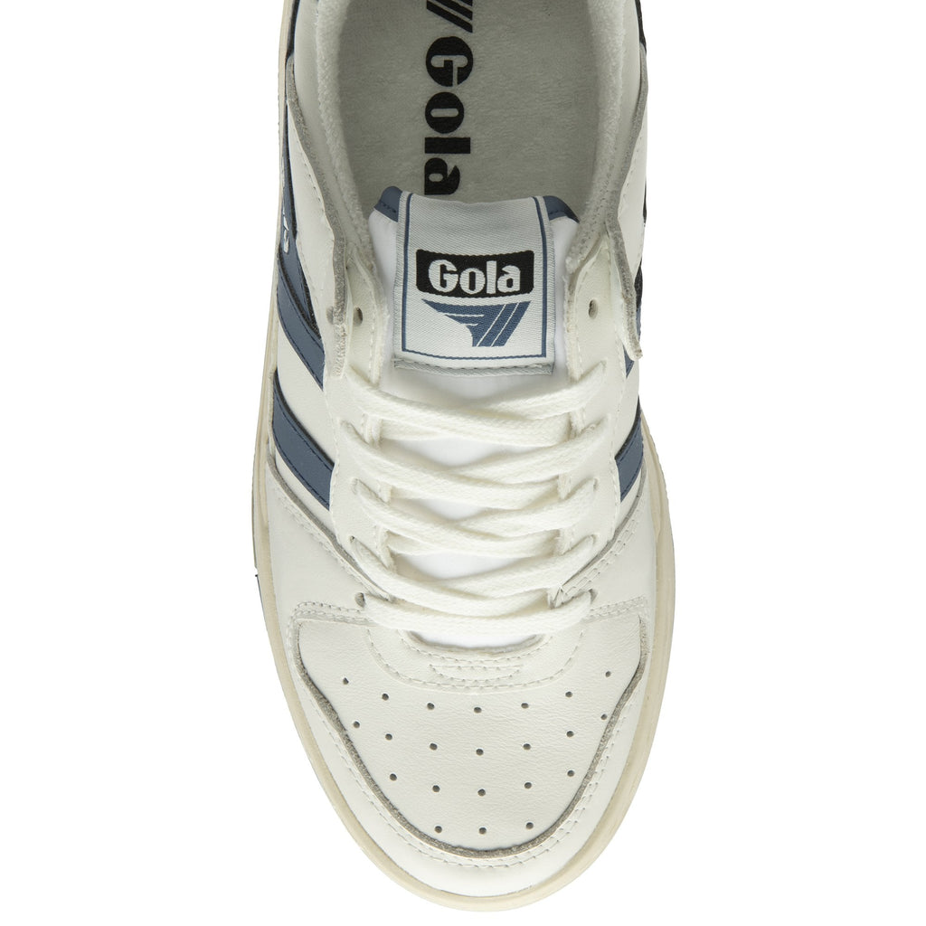 The top of a white and blue Gola sneaker.