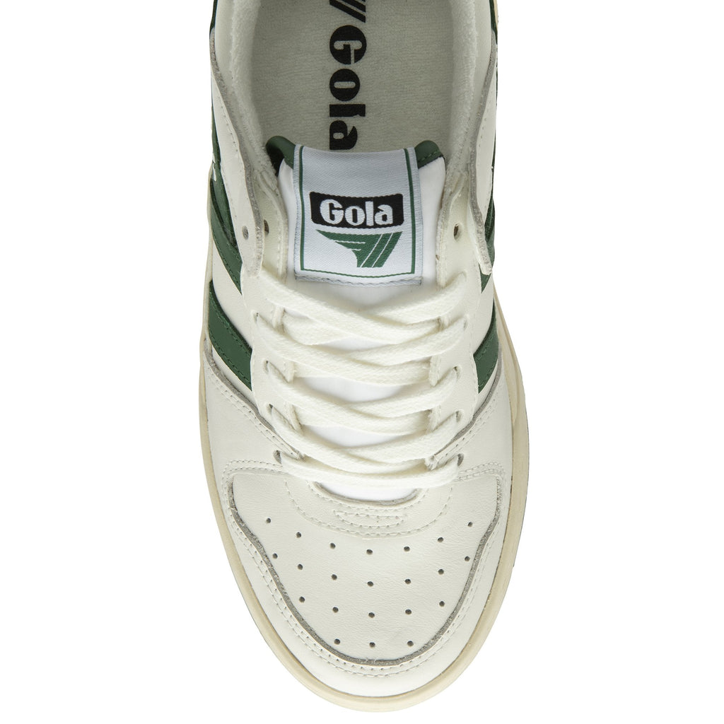 A top-down view of a white and green Gola sneaker, highlighting the laces and tongue.