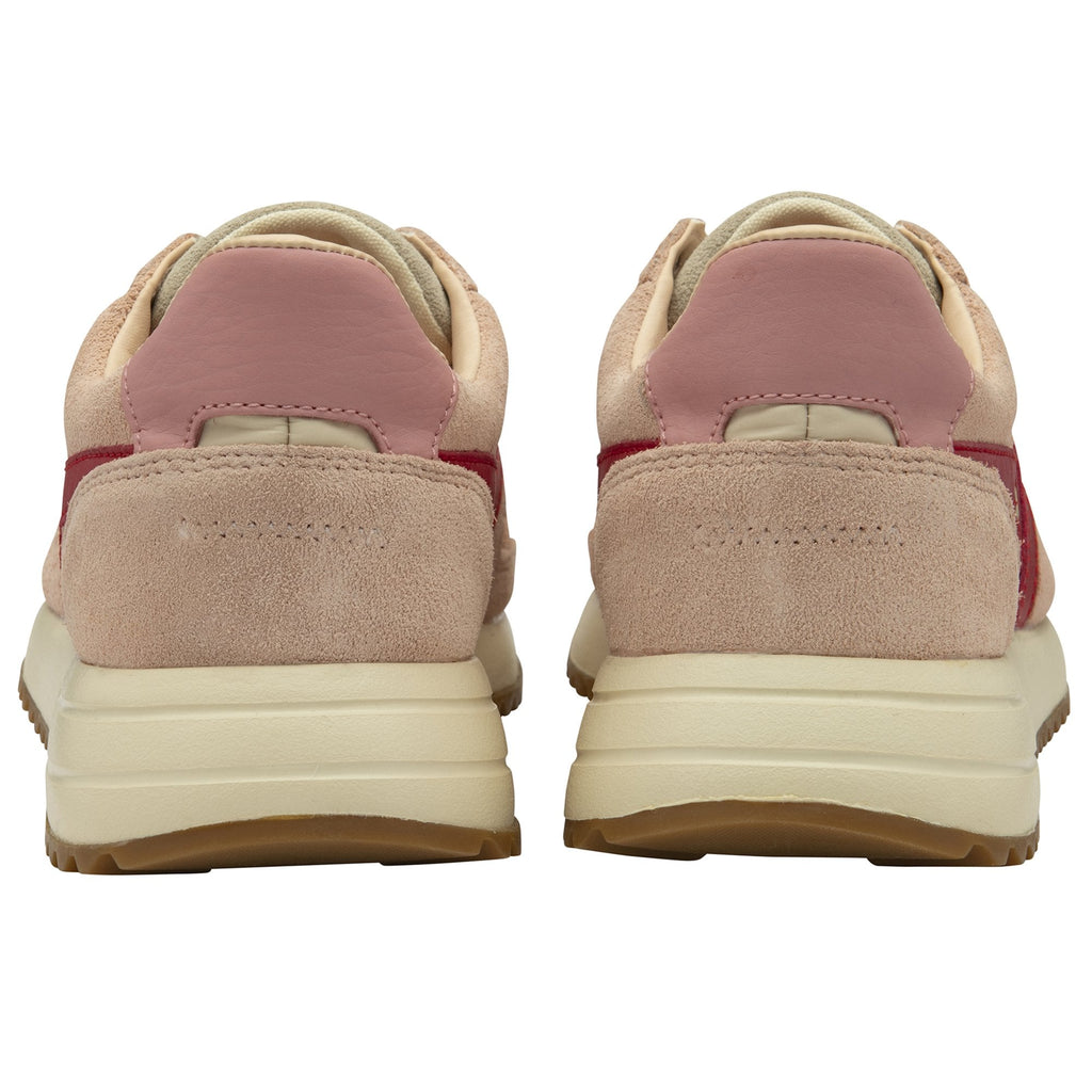 The back of two pale pink sneakers, showing the heels and part of the soles.