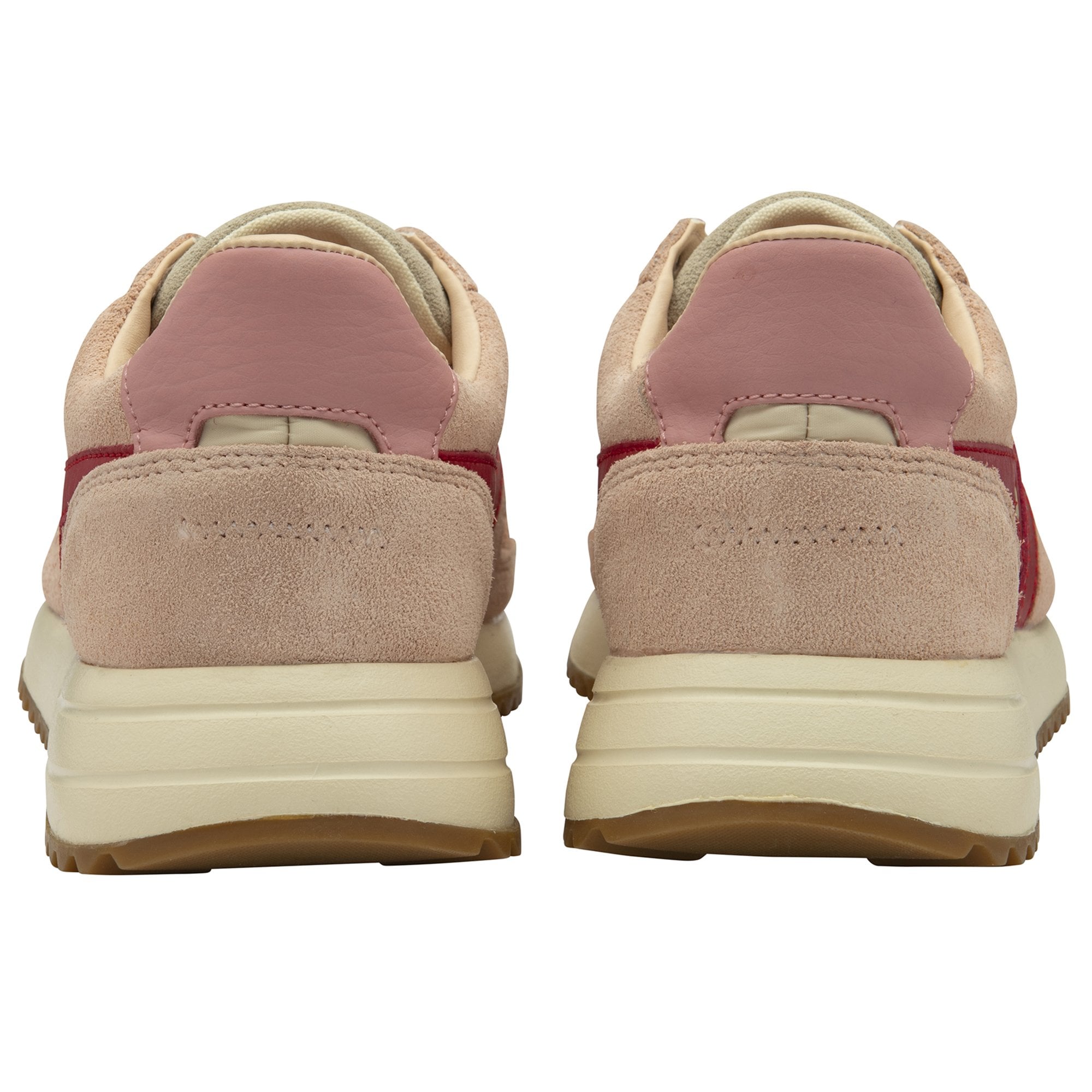 The back of two pale pink sneakers, showing the heels and part of the soles.