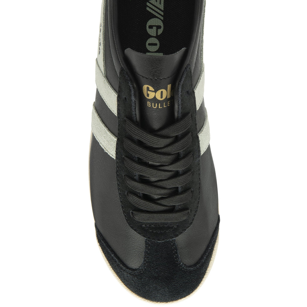 Top-down view of a black Gola Bullet trainer with white stripes and black laces.