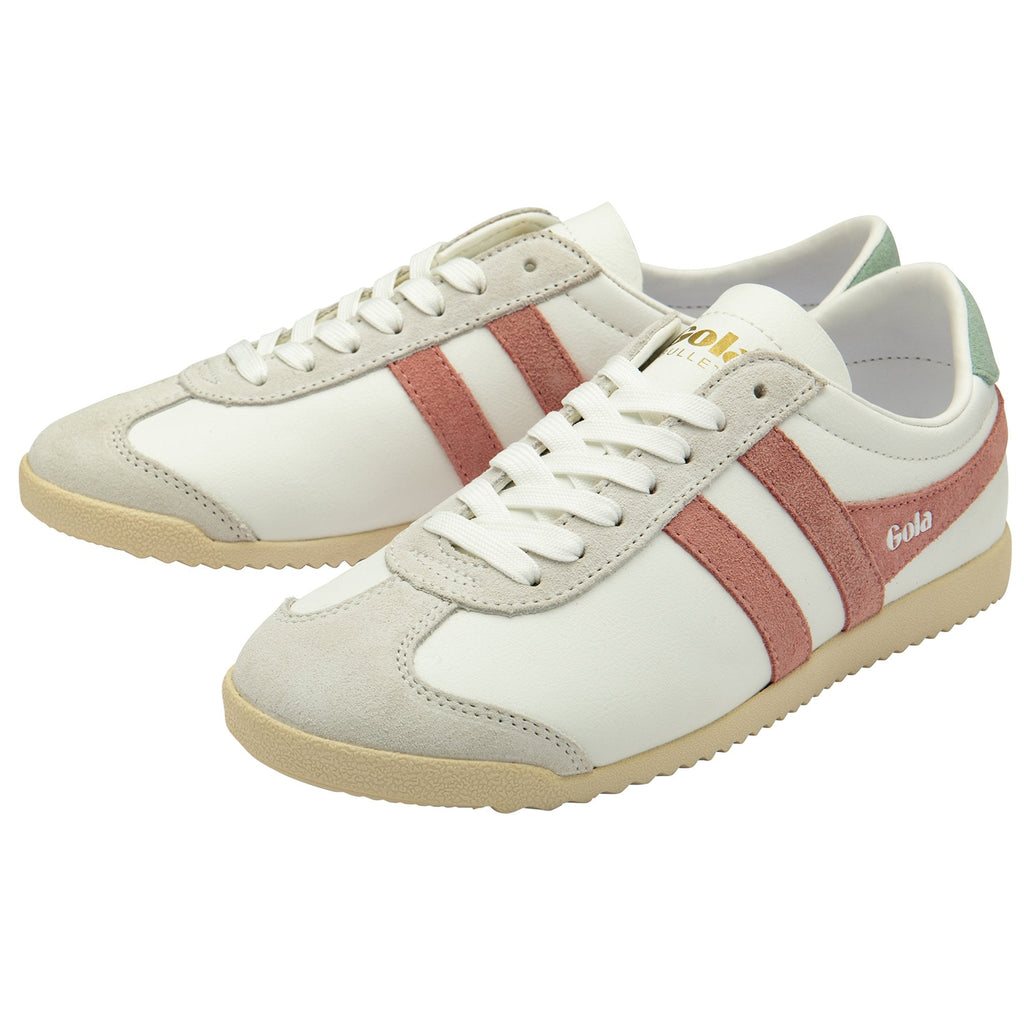 A pair of white Gola sneakers with pink stripes and green heel tabs.