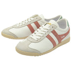 A pair of white Gola sneakers with pink stripes and green heel tabs.