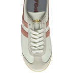 Top-down view of a white Gola sneaker with pink stripes and white laces.