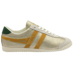 A right women's trainer, made of gold material with yellow stripes and a green heel collar.