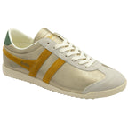 A left women's trainer, made of gold material with yellow stripes and a green heel collar.