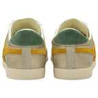 A back view of the heels of two women's trainers, in gold with green heel collars.