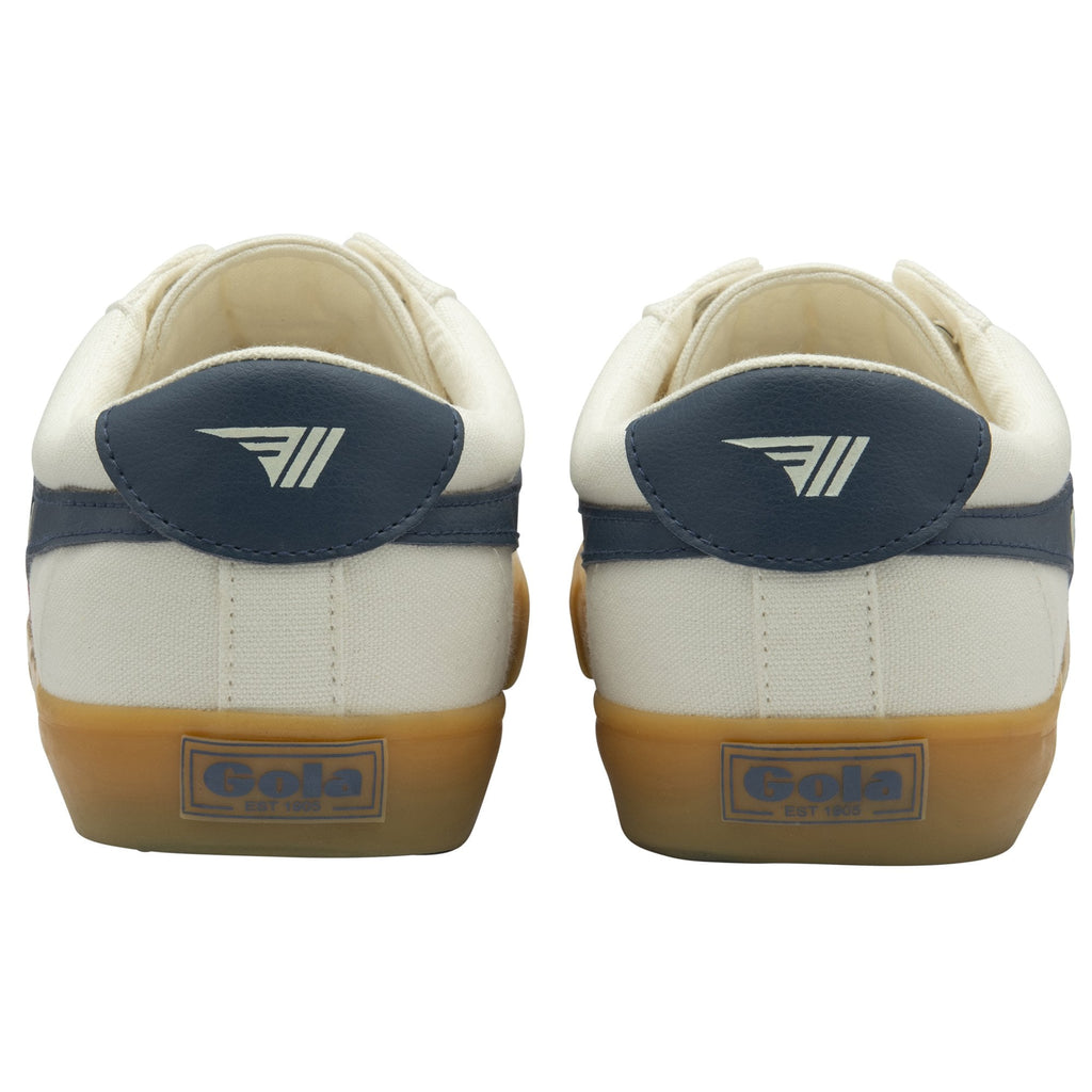 The back view of a pair of white Gola sneakers, showing the dark blue heel accents.