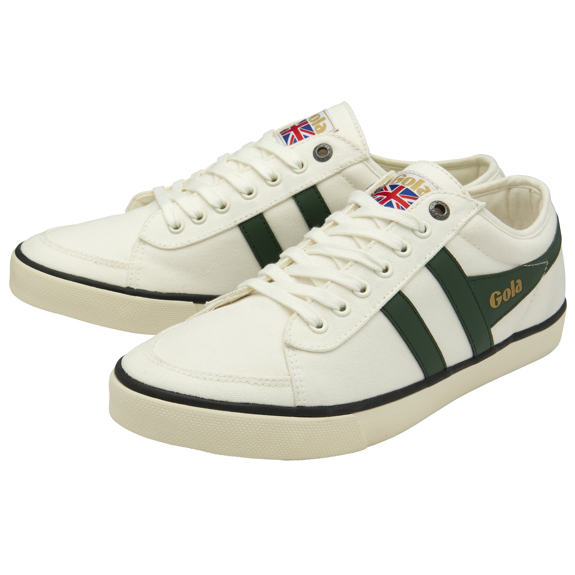 A pair of white Gola sneakers with green stripes, seen from an angle.