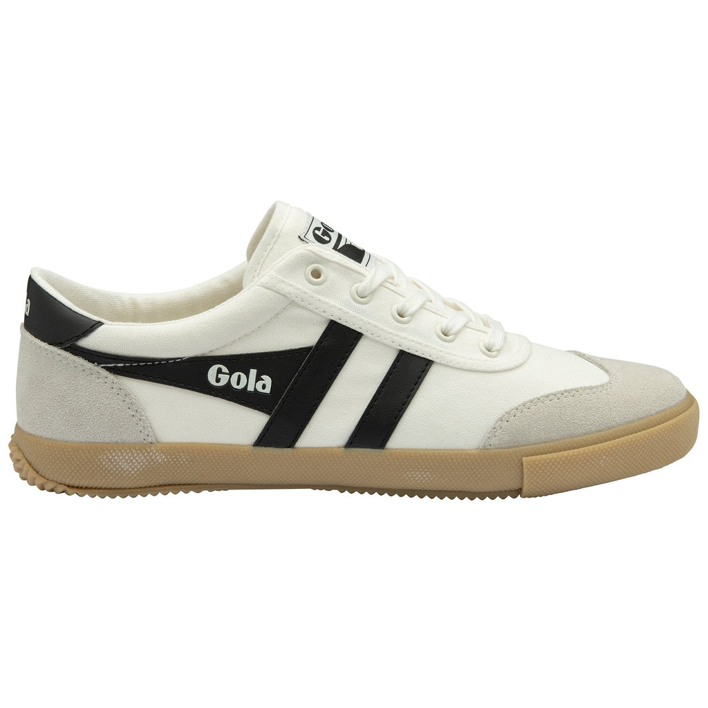 A single white Gola sneaker with black stripes from the side view.