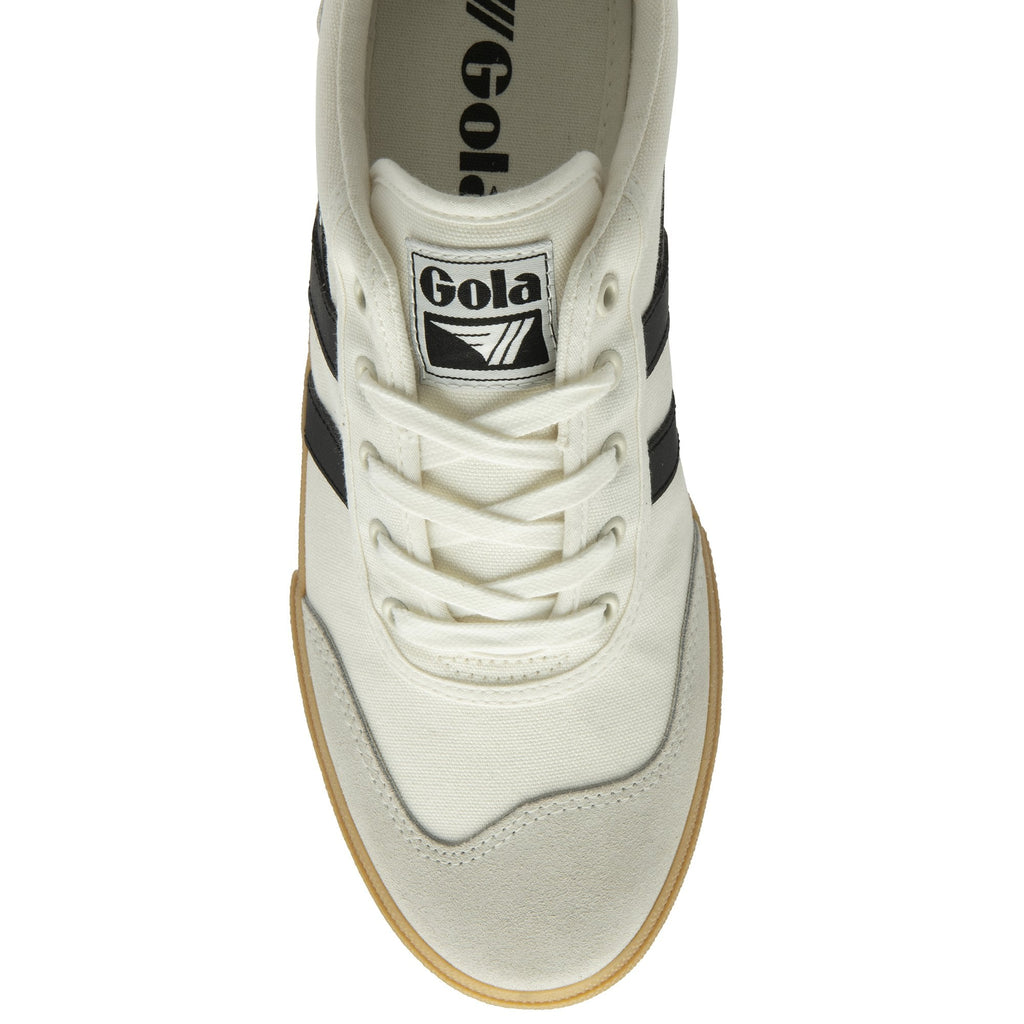 The top-down view of a white Gola sneaker with black stripes and laces.