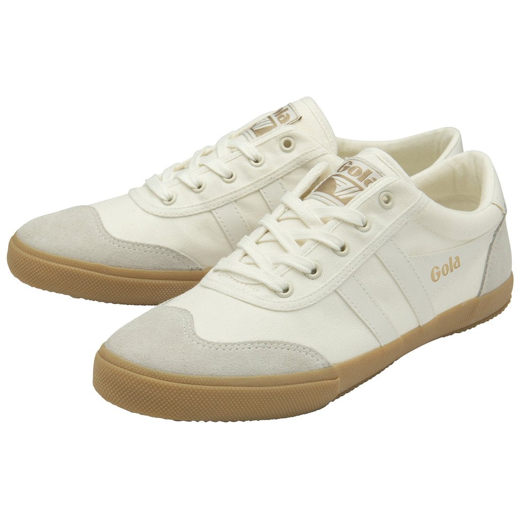 Pair of Gola Harrier Trainers in off-white with suede accents and gum soles, angled side view.