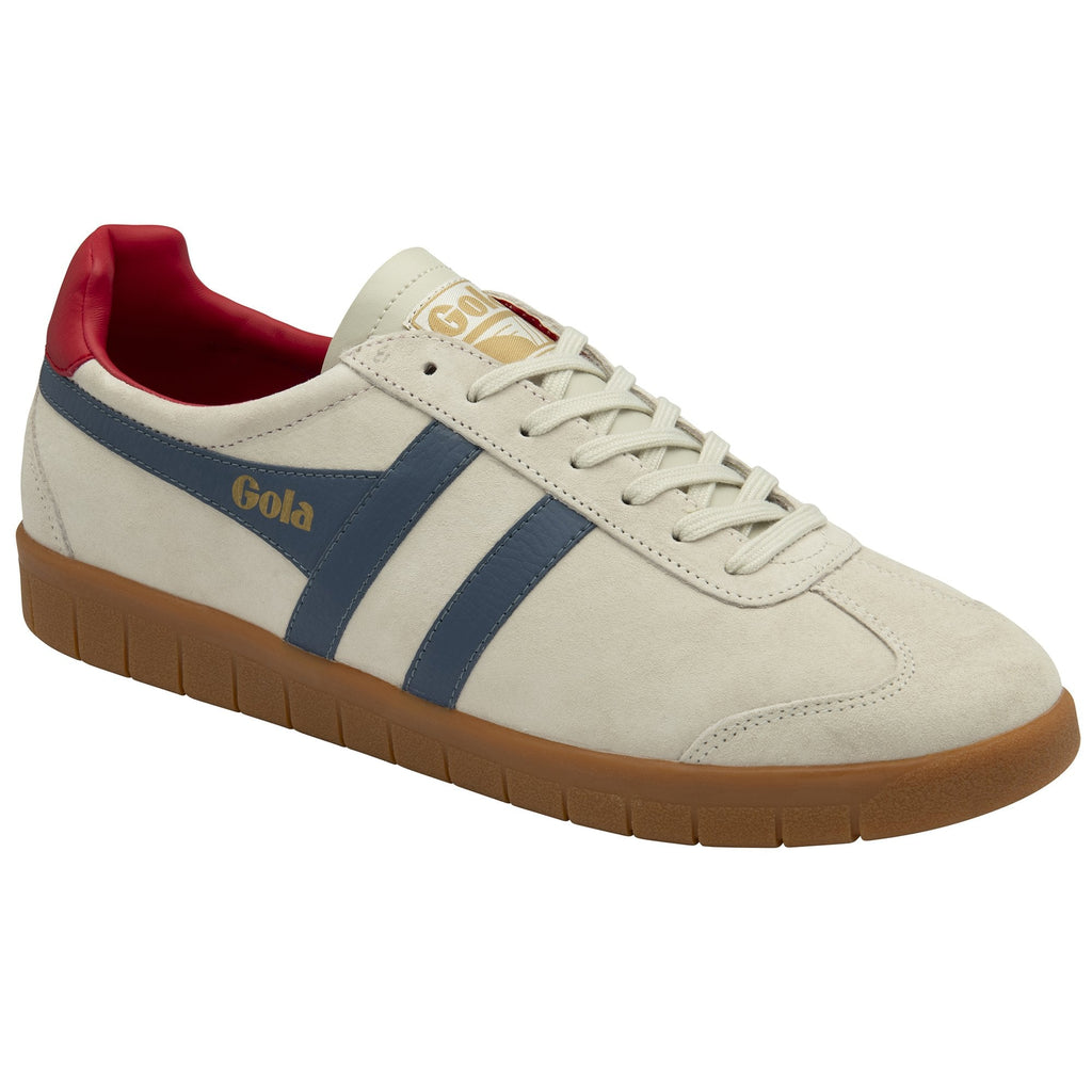 A beige Gola trainer with blue stripes, red heel accent, and brown sole.