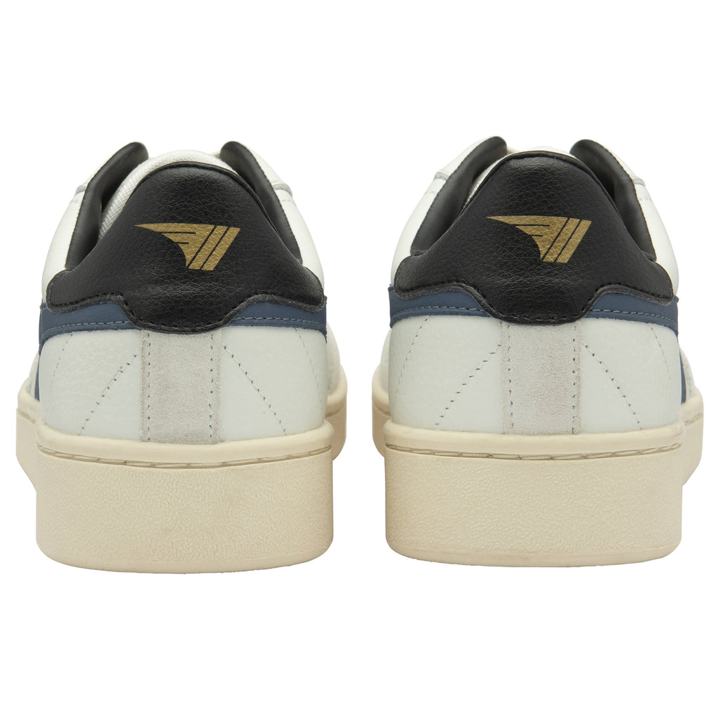 The back view of a pair of off-white Gola sneakers with black heel tabs.