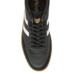 The top-down view of a black Gola sneaker with white stripes.