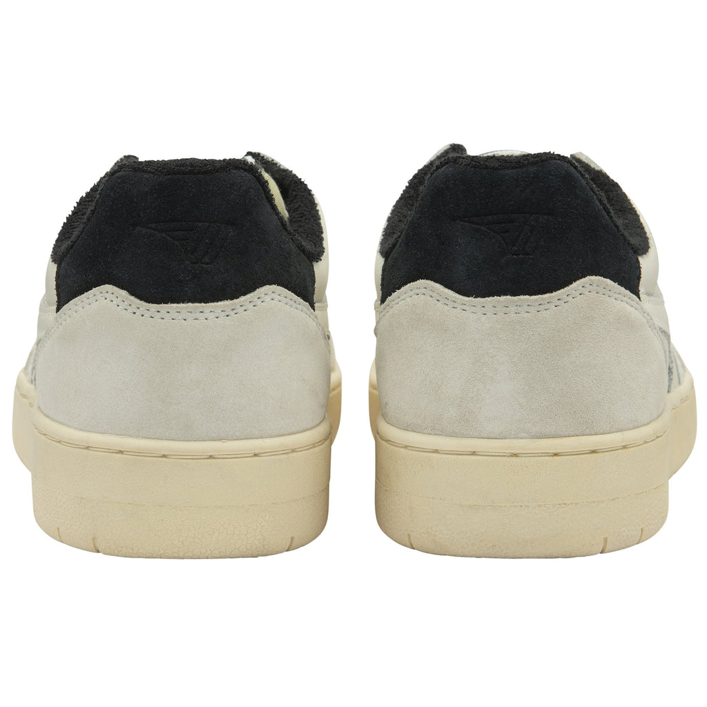 The back view of a pair of off-white Gola sneakers with black heel tabs.