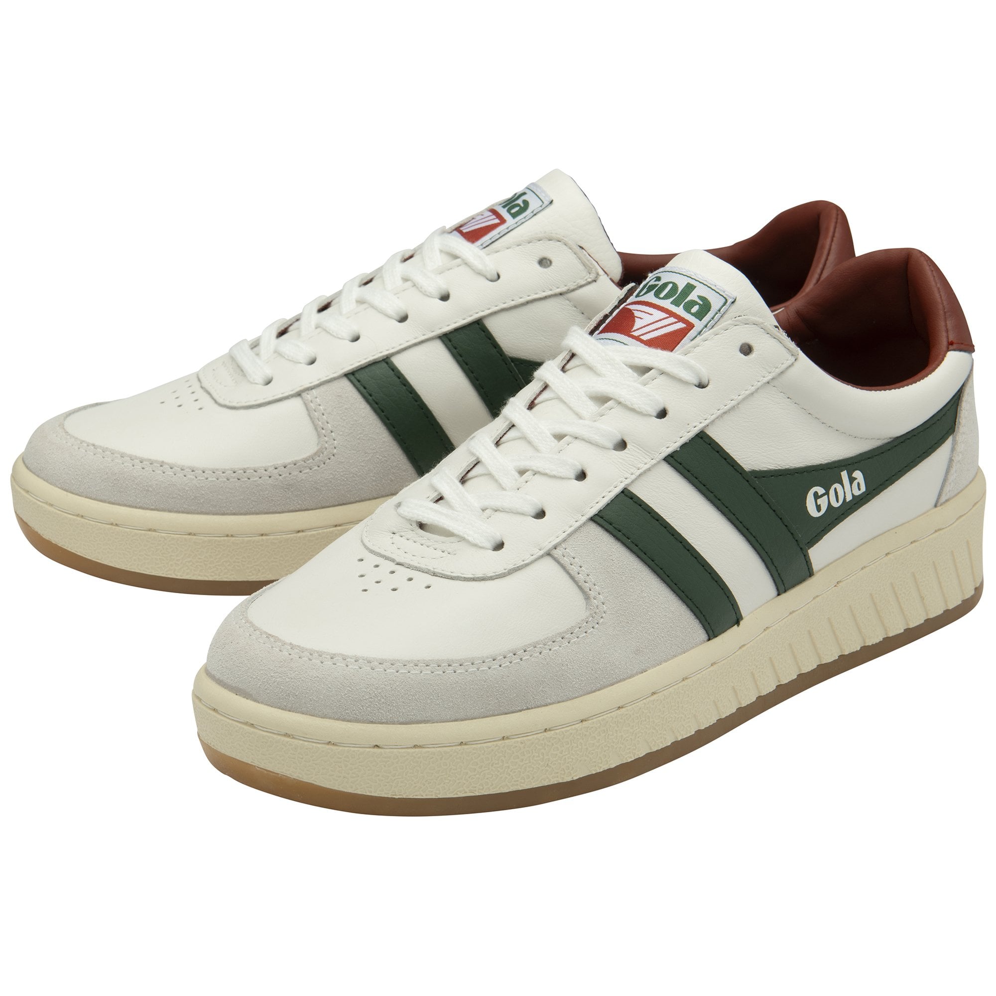 A pair of white and green Gola sneakers with brown heel tabs.